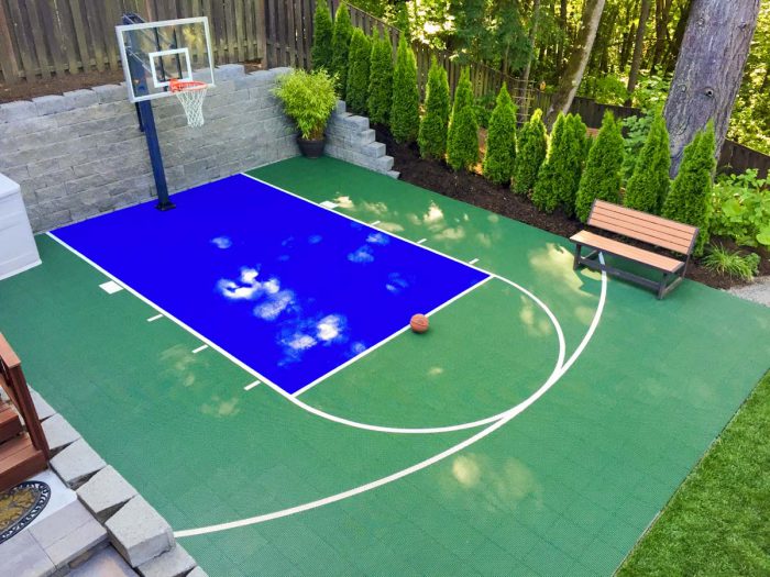 A DunkStar basketball court installed in a backyard