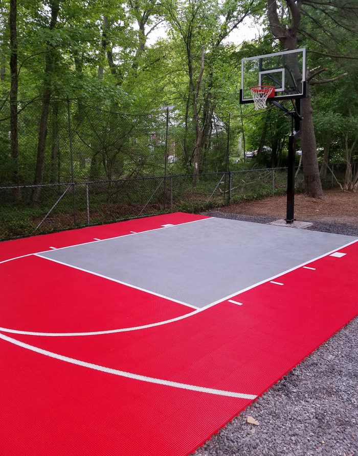 Red and gray backyard basketball court