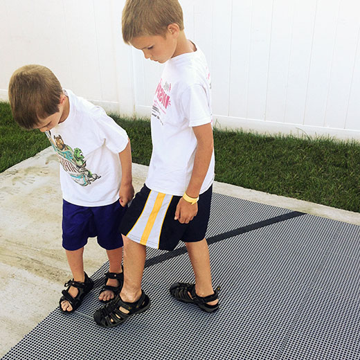 Kids installing an easy-to-install DunkStar court