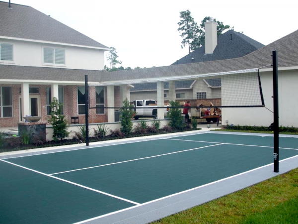 Evergreen and gray backyard volleyball court