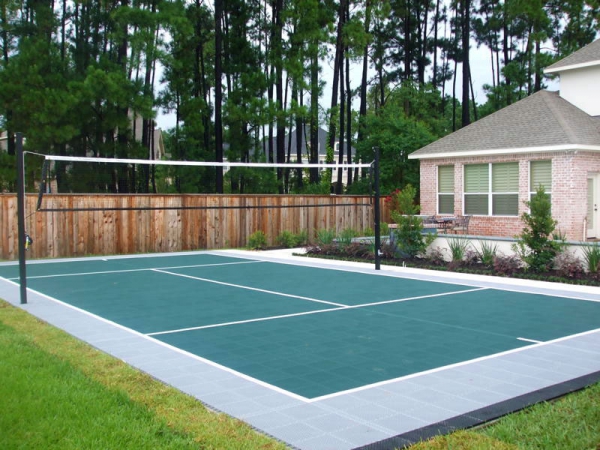 Backyard volleyball court in evergreen and gray