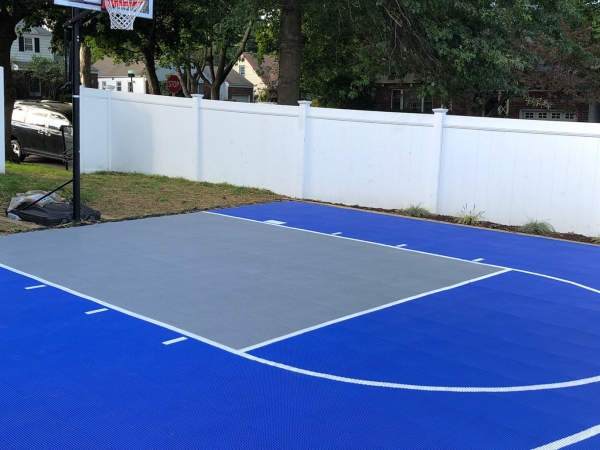 Bright blue and gray basketball half court