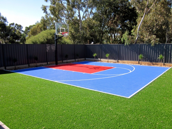 Small basketball half court in bright blue and red