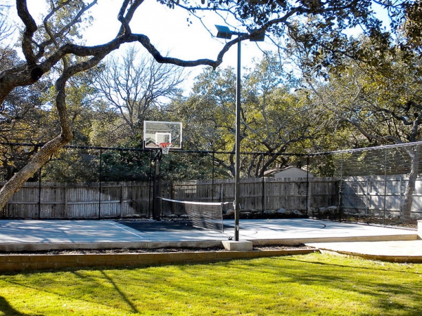 Gray half multi-court with fencing