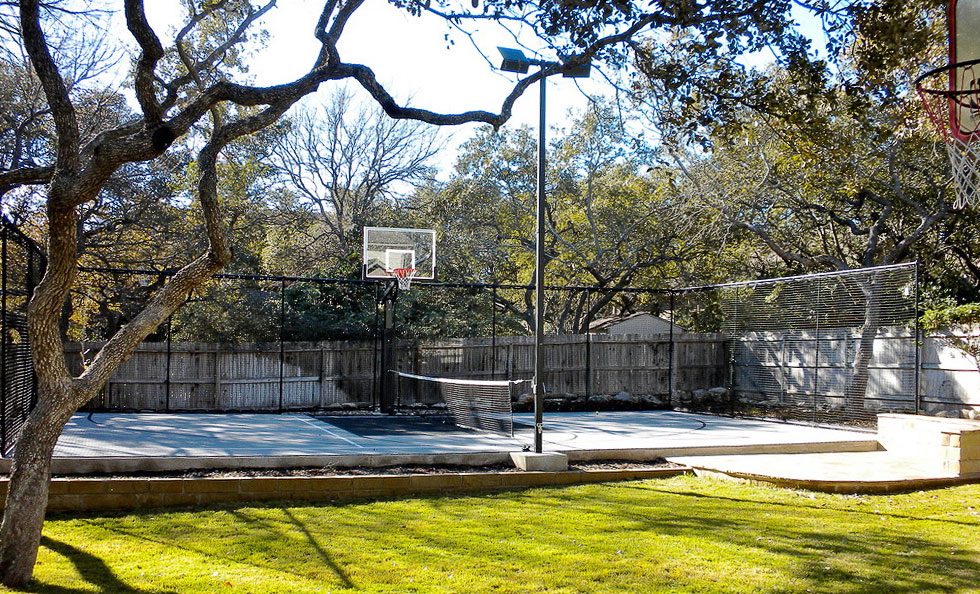 Gray half multi-court with fencing