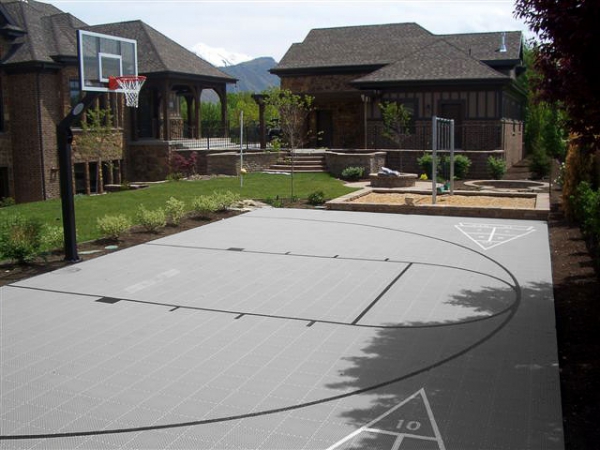Gray half-court with basketball and custom hopscotch lines