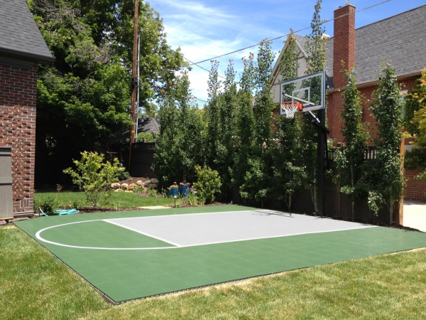 Green and gray small backyard basketball court