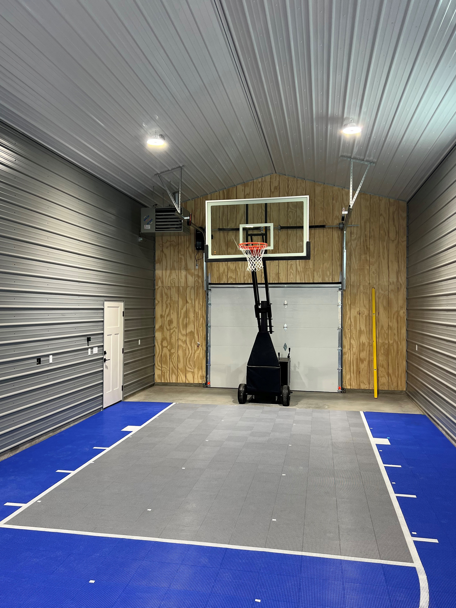 Indoor basketball court with blue and gray colors