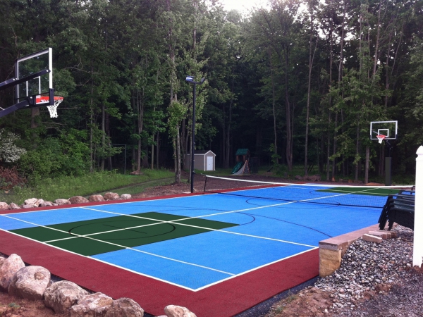 Multicolored multi-court with nets, hoops, and lights