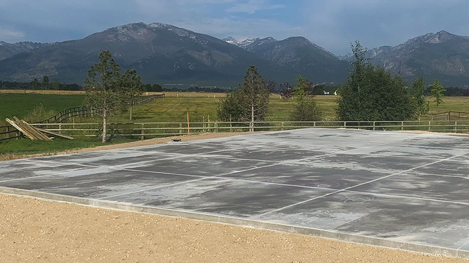 A concrete pad for a basketball court