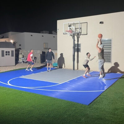 men-playing-basketball-night